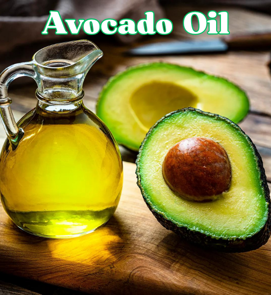 Avocado oil in a glass container next to a avocado cut in half on a wooden surface and the text 'Avocado Oil'.