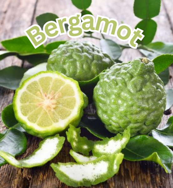 Bergamot fruit with green leaves on a wooden surface, labeled 'Bergamot'.