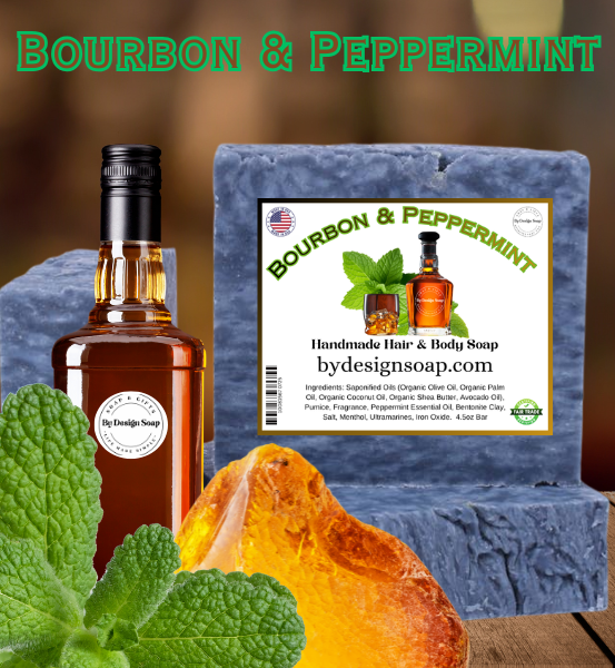 Image of 'Bourbon & Peppermint' Handmade soap for hair and body next to a bottle of bourbon and mint leaves on a wooden surface.