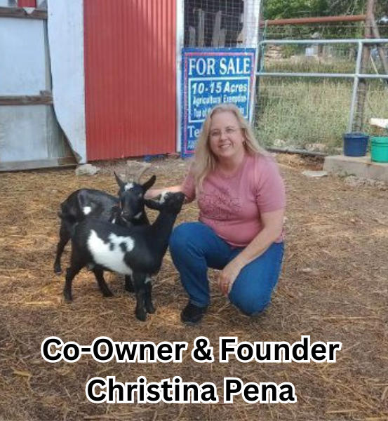 Woman kneeling next to two baby goat's in front of a red barn, identified as the founder and owner of BDS Christina Peña.