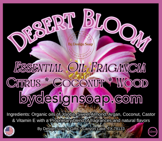 Advertisement for Desert Bloom essential oil fragrance with a pink flower and the text Citrus, Coconut and Wood.