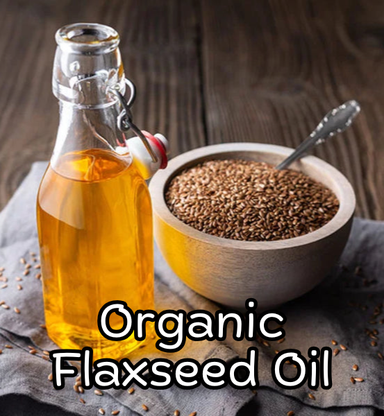 Bottle of organic flaxseed oil next to a bowl of flaxseeds on a wooden surface with the text 'Organic Flaxseed Oil'