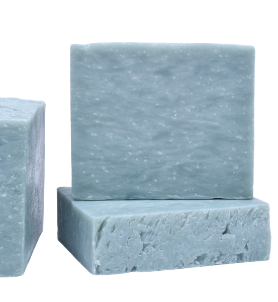 Three bars of blue soap on a white background.