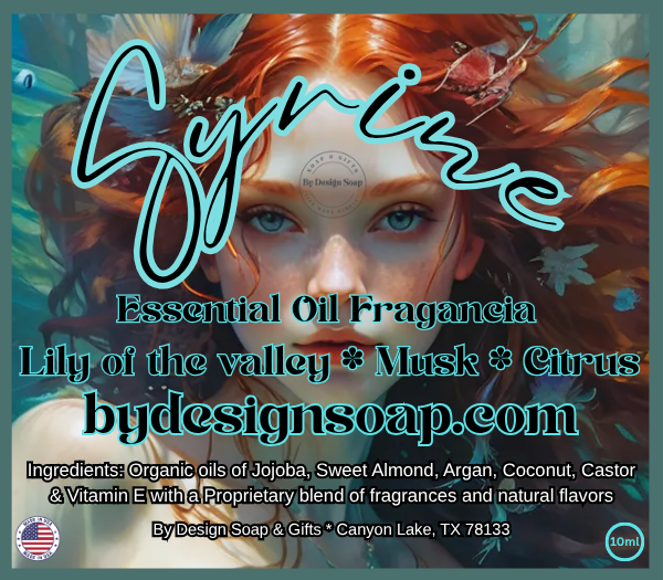 Advertisement for Syrine Essential Oil Fragrance with a stylized woman's face and product details of Lily of the Valley, Musk and Citrus. Plus a Made in the USA label.