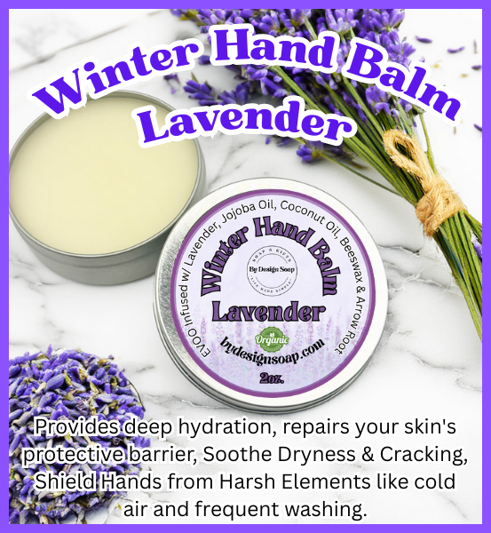 round silver tin with lavender winter hand balm written on the label sitting on a white marble slab with dark purple lavender flowers and lavender buds surrounding it .