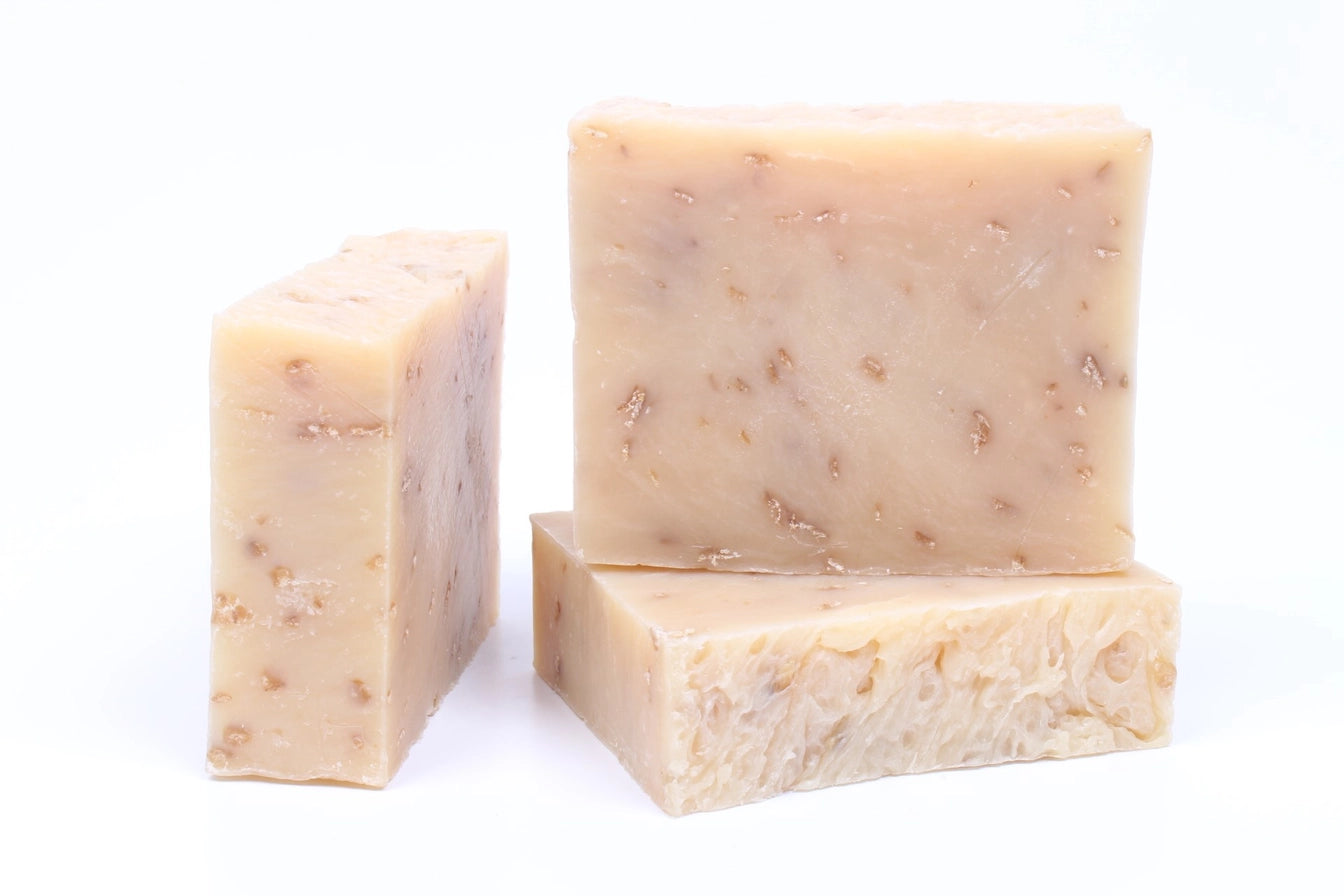 Image of three natural homemade oats and goats milk soaps.