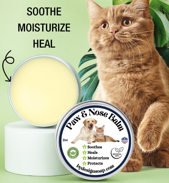 Advertisement for 'PAW AND NOSE BALM' with a Brown cat lifting his paw and the text SOOTHE, MOISTURIZE AND HEAL.