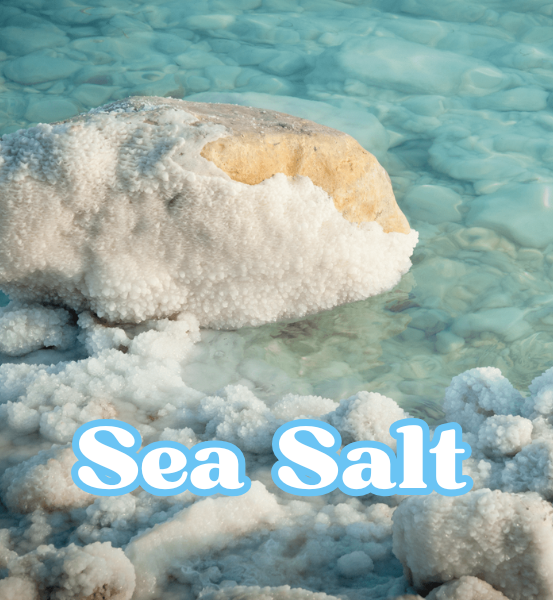 Rocky shoreline with salt crystals and clear water and the text 'Sea Salt'.